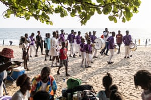 Members of the Area 10 Scout brass band play along Lumely beach in Freetown