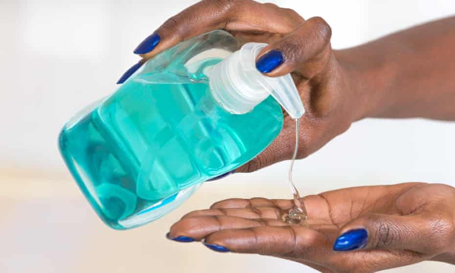 A woman uses hand gel.
