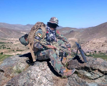Unidentified soldier on a rock.