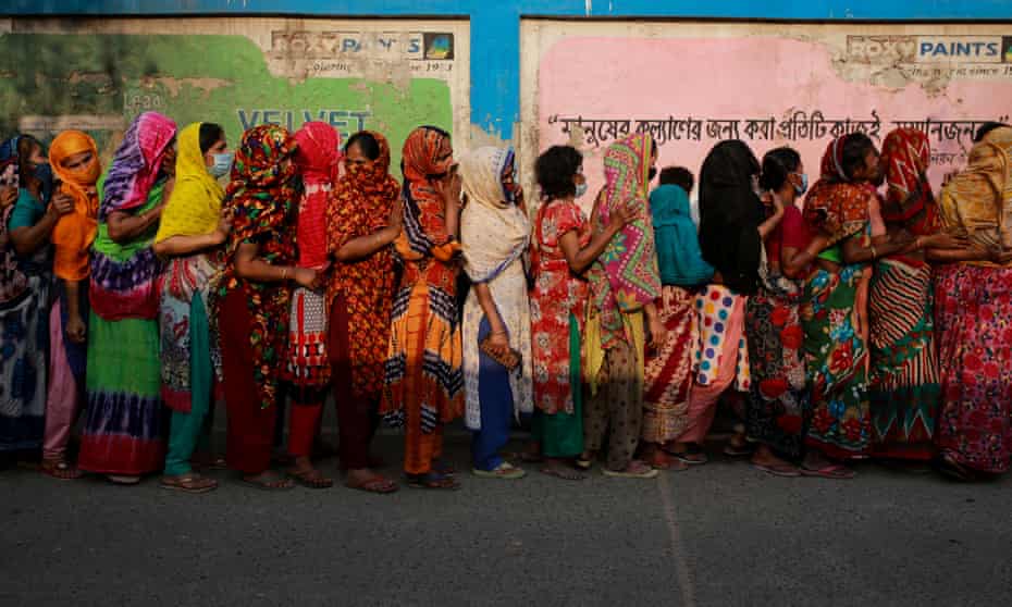 Women queue to collect aid during the nationwide lockdown in Bangladesh