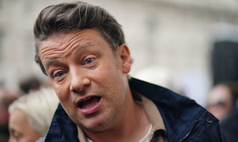 Jamie Oliver takes part in a demonstration outside Downing Street in May against the government's decision to delay a ban on two-for-one deals on unhealthy foods
