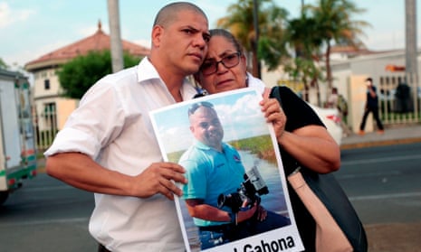 The mother and brother of journalist Ángel Gahona,who died while reporting on an anti-government protest in Bluefields, demonstrate in Managua earlier this month.
