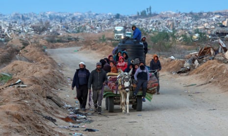 Palestinians make their way on donkeys near the Gaza Strip.
