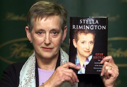 Rimington holding up a copy of her autobiography in 2001
