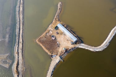 A patch of farmland surrounded by water in Dawanggang, Hebei Province