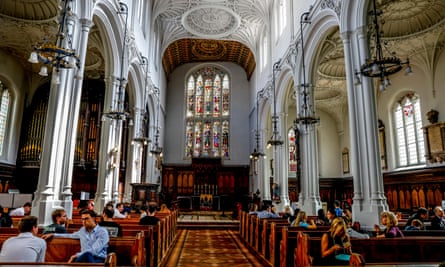 People relax in the cafe at St Mary Aldermary church in the City of London.