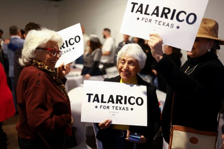 people holding signs