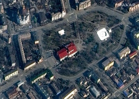 Satellite image showing the word ‘children’ painted in large Russian script on the ground outside a theatre in the city before the strike on March 14