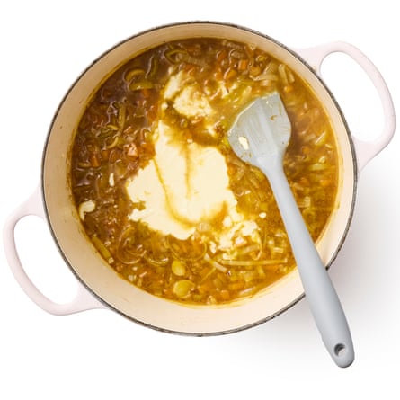 stirring the milk mixture into the soup