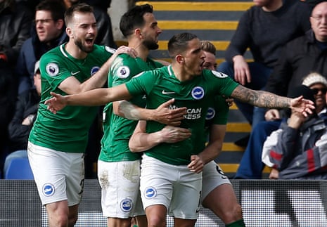 Knockaert celebrates with teammates after scoring Brighton’s second goal.