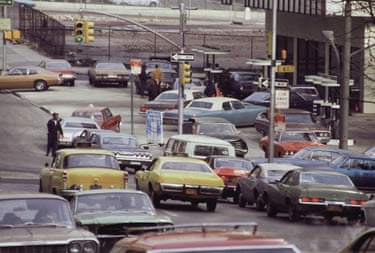 Cars wait in line at a gas station
