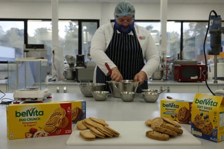 Chef mixing products in a kitchen with Belvita products in the foreground