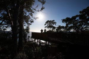 Silhouetted hikers looking over the Munro Bight.