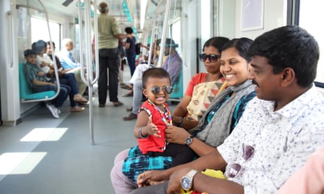 People travel on the Kochi metro in Kerala, India