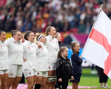 England's Zoe Aldcroft (right) lines up with her players as they sing the national anthem.