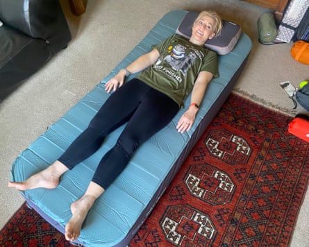 Linda Geddes lies on a camping mattress in her home