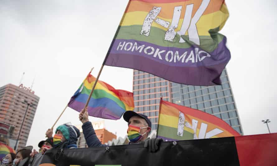 Demonstrators from the LGBTQ+ group Homokomando take part in a rally to show solidarity n Warsaw