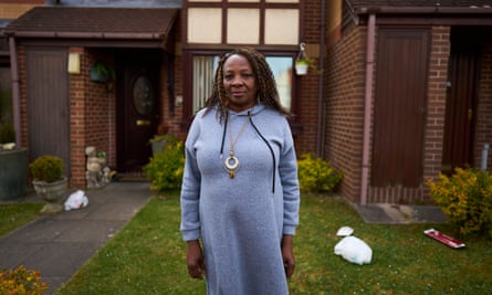 Gloria Charles stood outside her home