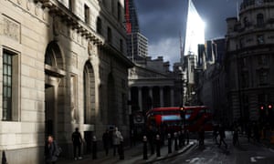 People walk through the City of London financial district today