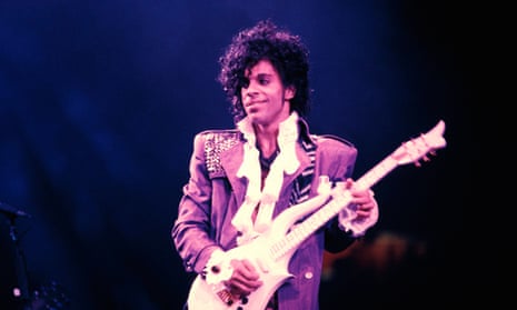 Prince performing on stage during the Purple Rain Tour in 1984.