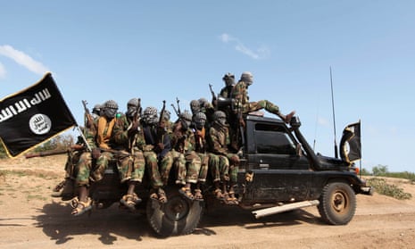 Members of al-Shabaab ride in a pick-up truck in Somalia. The group has been targeting Kenyans since 2011