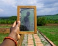 An image of a man printed on a banana leaf held up in the hand of the Nigerian-Canadian artist Kosisochukwu Nnebe, who created it.