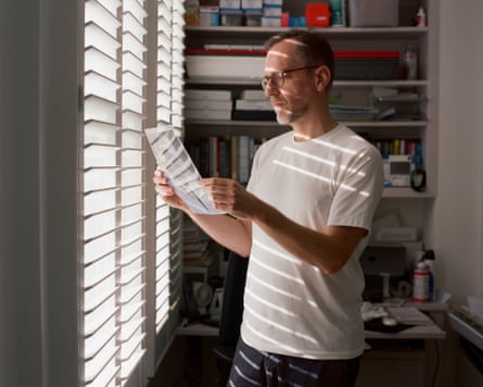 David Batty, looking at portrait of his birth father Monti