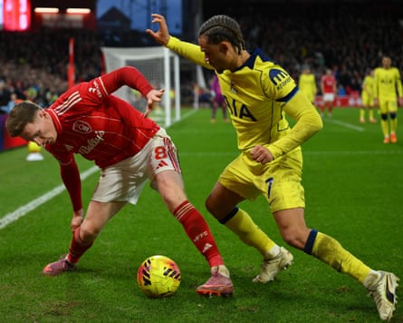Xavi Simon (right) battles for the ball with Elliot Anderson