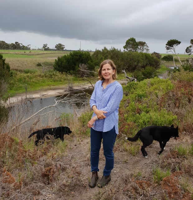 Elizabeth Balderstone stands next to Warrigal Creek on her farm in Victoria