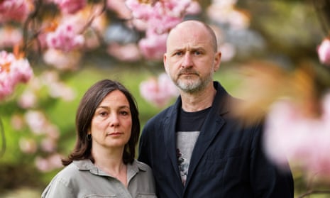 Mark and Ros Dowey pictured surrounded by tree blossom