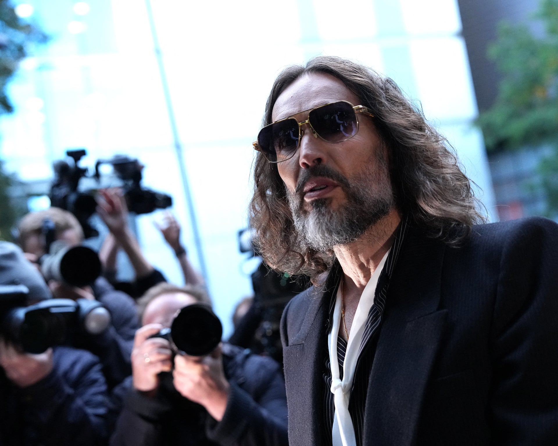 Photo: The Guardian Russell Brand Trial: Complainant Details Alleged Hotel Room Rape in Court Interview
