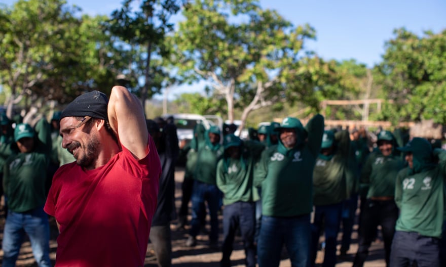 Indigenist Carlos Travasso leads stretching exercises with the Guardians of the Forest during the event in Zutiwa.