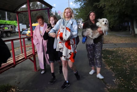 Residents move towards a shelter amid Russia’s attack in Kyiv.