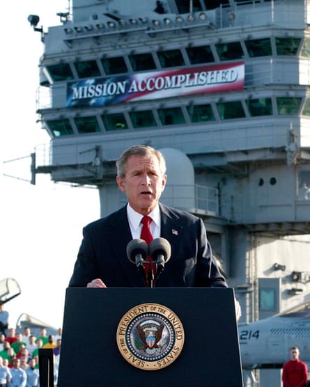 George W Bush addresses military personnel aboard the USS Abraham Lincoln in 2003.