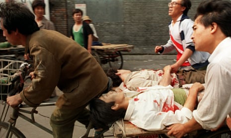 A rickshaw driver helps the wounded during Tiananmen Square protests in Beijing, 4 June, 1989.
