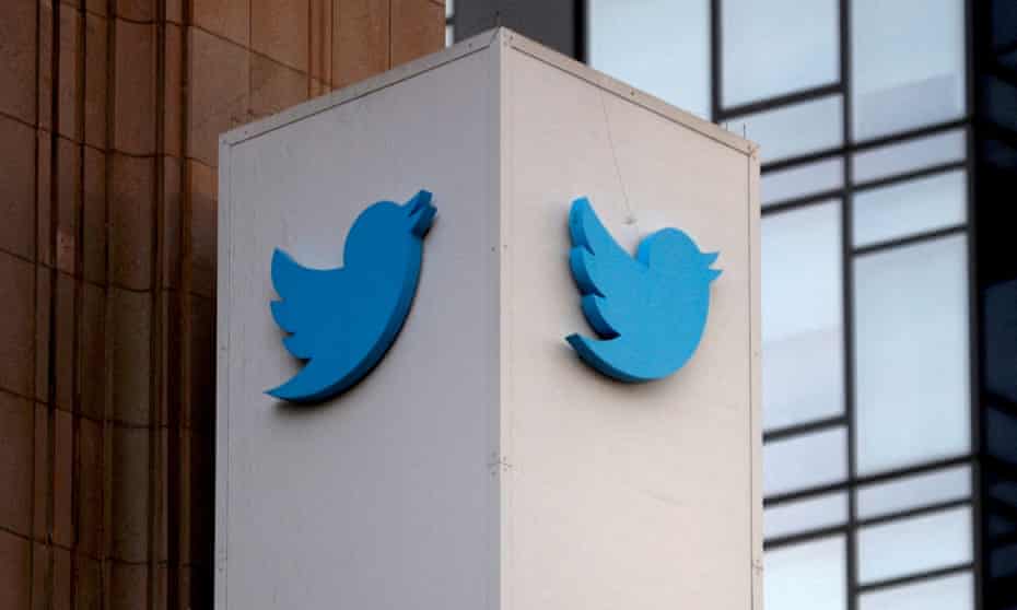 A blue Twitter logo is seen on a building