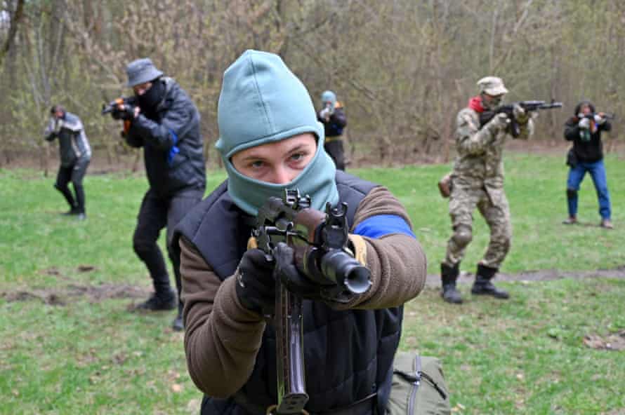 People take part in a combat training course at a recruiting centre of the Ukrainian Armed Forces in Kharkiv.