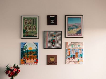 Pictures hanging on the wall depicting scenes and maps of Palestine and Syria