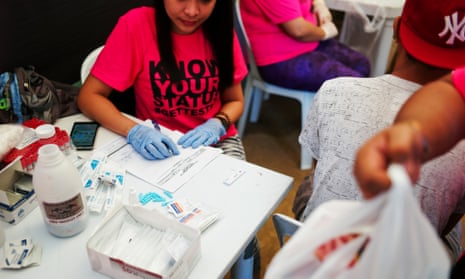 Health officials conduct rapid HIV testing during a fun run in Cebu City, December 2015.