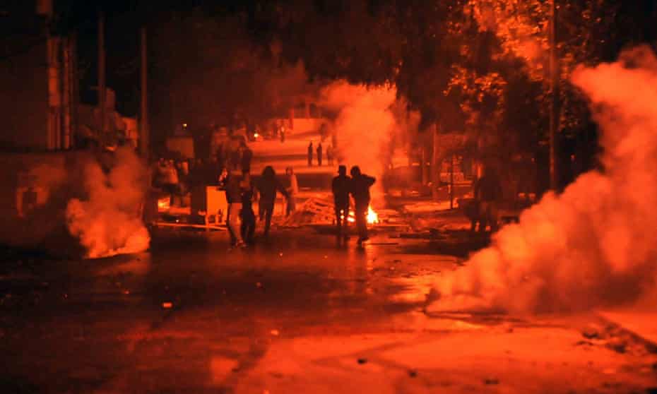 Tunisian security forces use teargas against protesters in Ettadhamen.