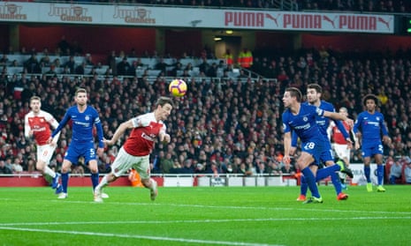 Laurent Koscielny scores with his shoulder to double Arsenal’s advantage in the 2-0 victory over Chelsea at the Emirates Stadium.