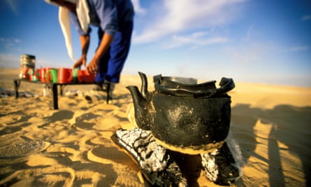 Preparing tea on a desert trek.