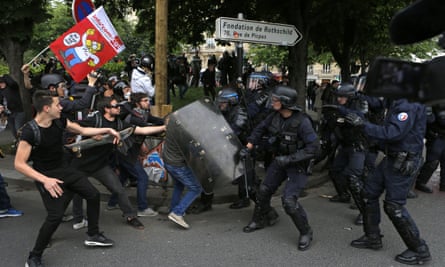 Riot police and protesters during a demonstration against the reforms in Paris.