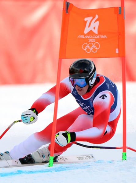 Franjo von Allmen skis past a gate on his way to winning gold in the men’s super-G.