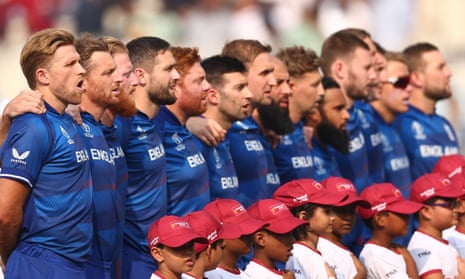 David Willey (left) and his England teammates sing the British national anthem.