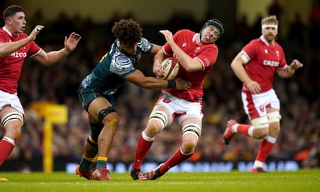 Australia’s Rob Valetini (left) tackles Wales’ Adam Beard, resulting a red card.