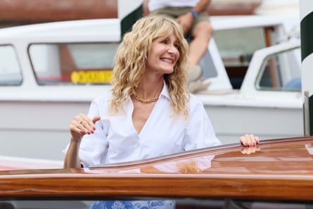 Laura Dern in a white shirt on a boat in Venice