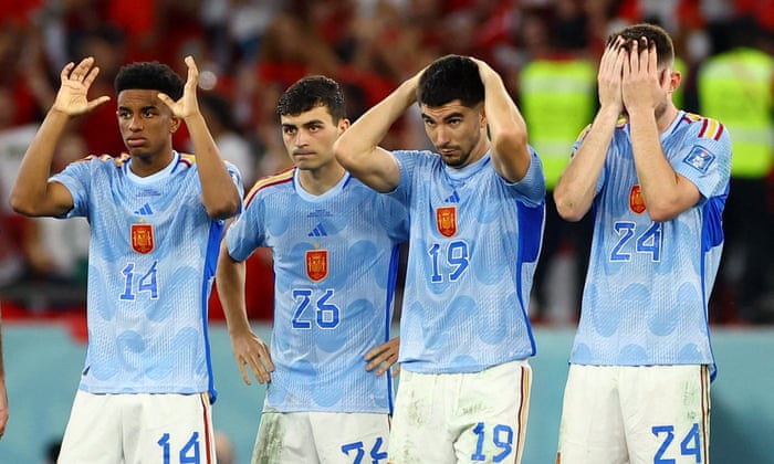 Out: Spain players look dejected after losing the match. Photograph: Bernadett Szabó/Reuters