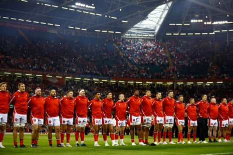 Wales players sing their the national anthem before the match against England.
