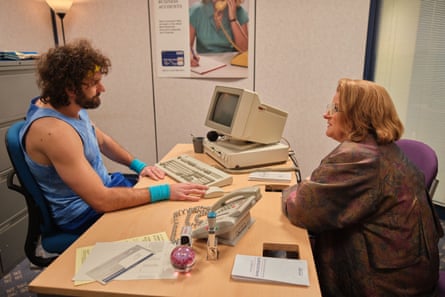 Diane Parker sits opposite Lee at an office desk.